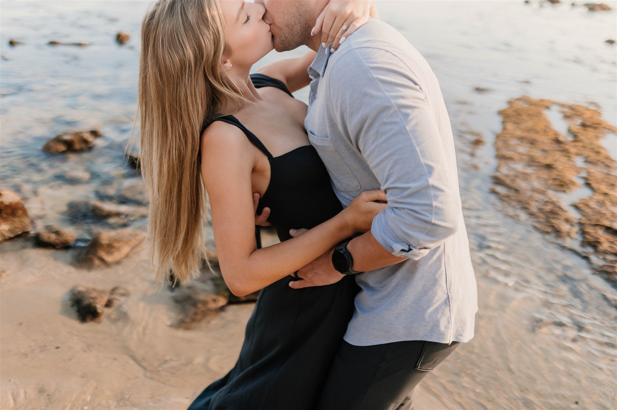 couple kissing on a beach Fun and Playful Laguna Beach Couples Photos