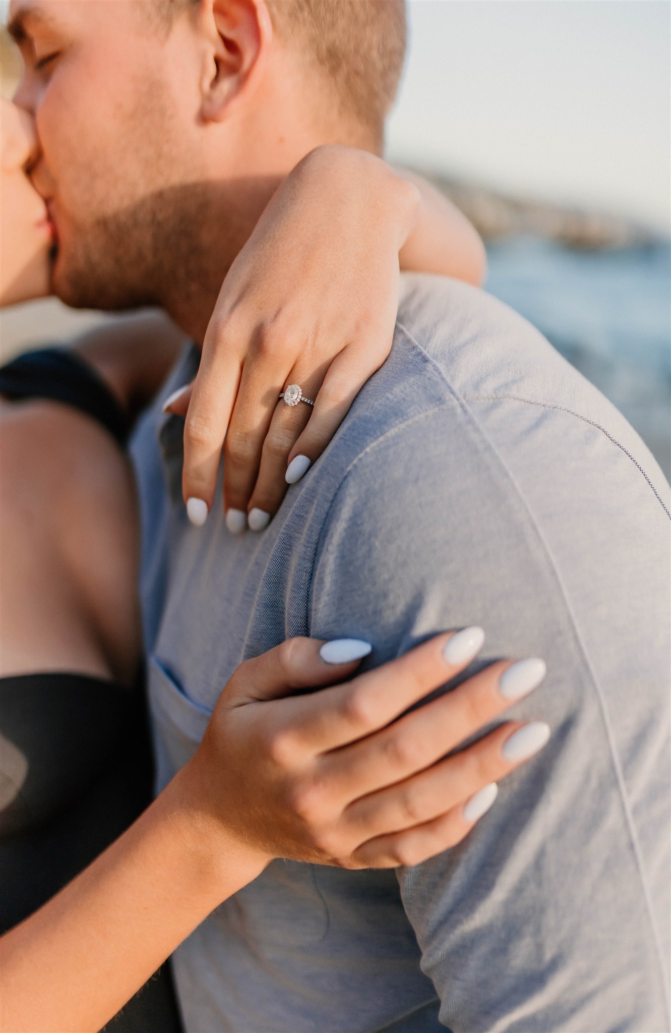 up close photo of an engagement photo on girls hand