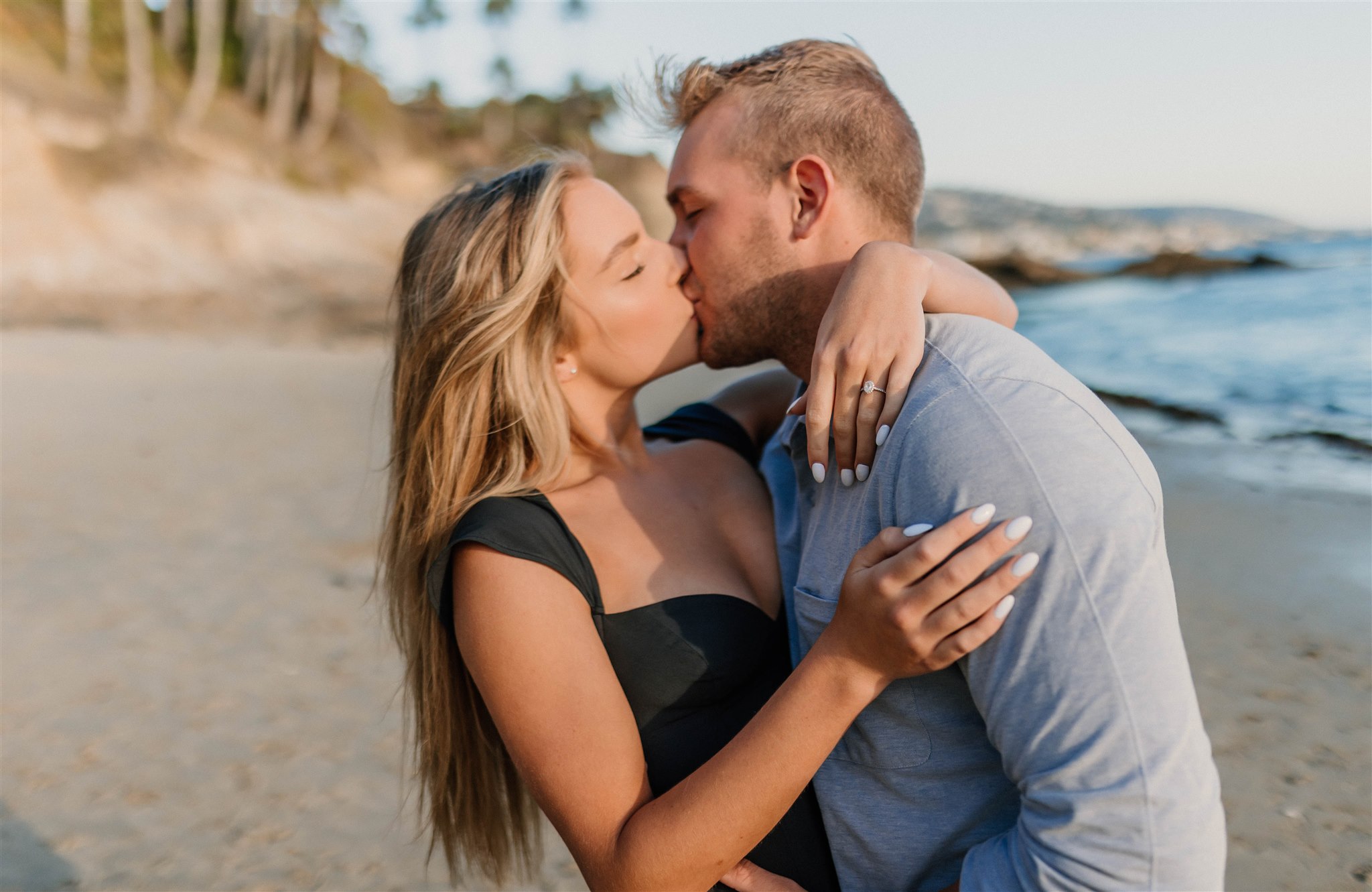 couple kissing on a beach