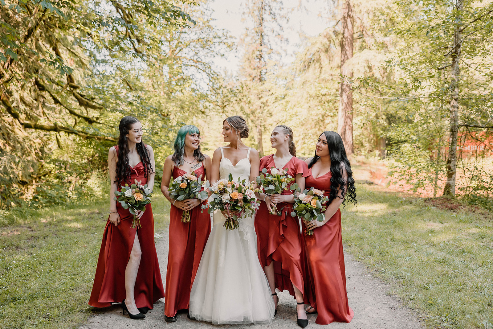 bride posing with her bridesmaids Camp Colton - A Mystical Oregon Wedding Venue