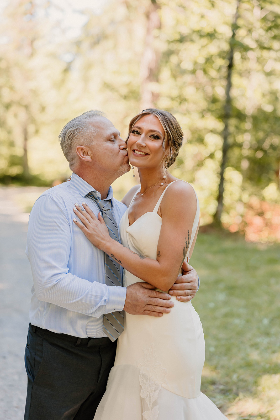 brides father kissing her on the cheek Camp Colton - A Mystical Oregon Wedding Venue