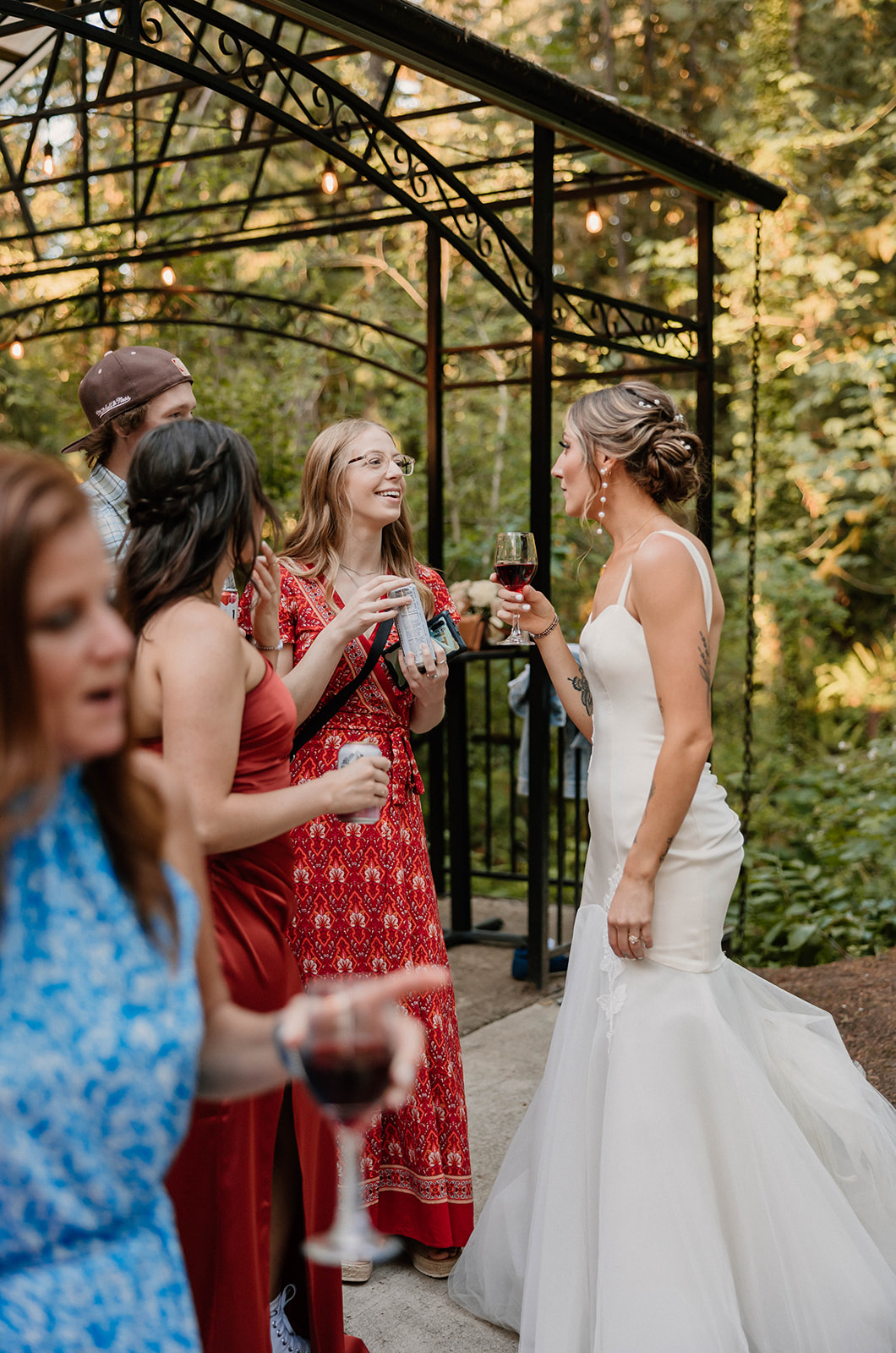 bride hanging out and talking with her friends during her reception