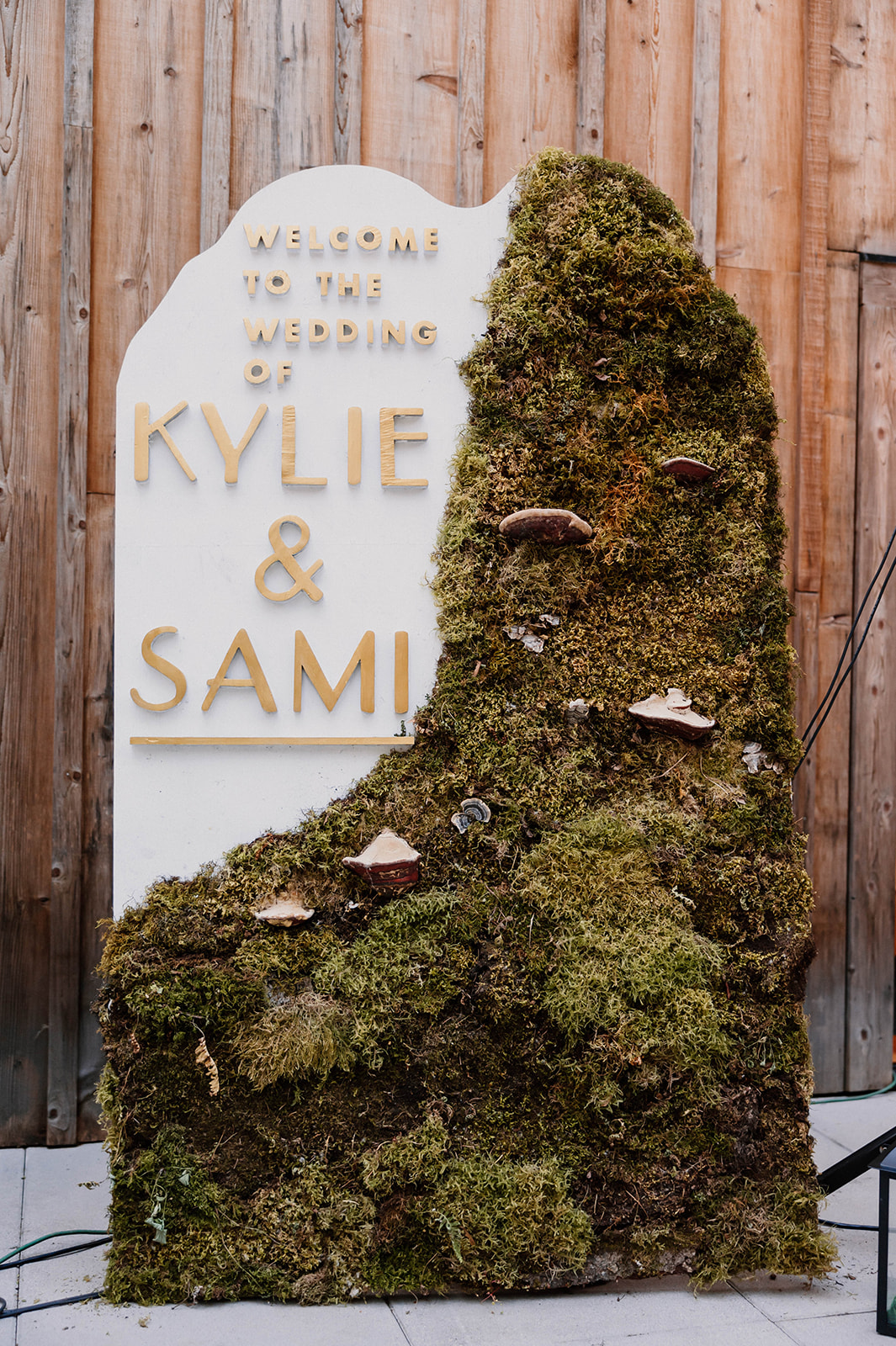 a mossy sign for a wedding Camp Colton - A Mystical Oregon Wedding Venue