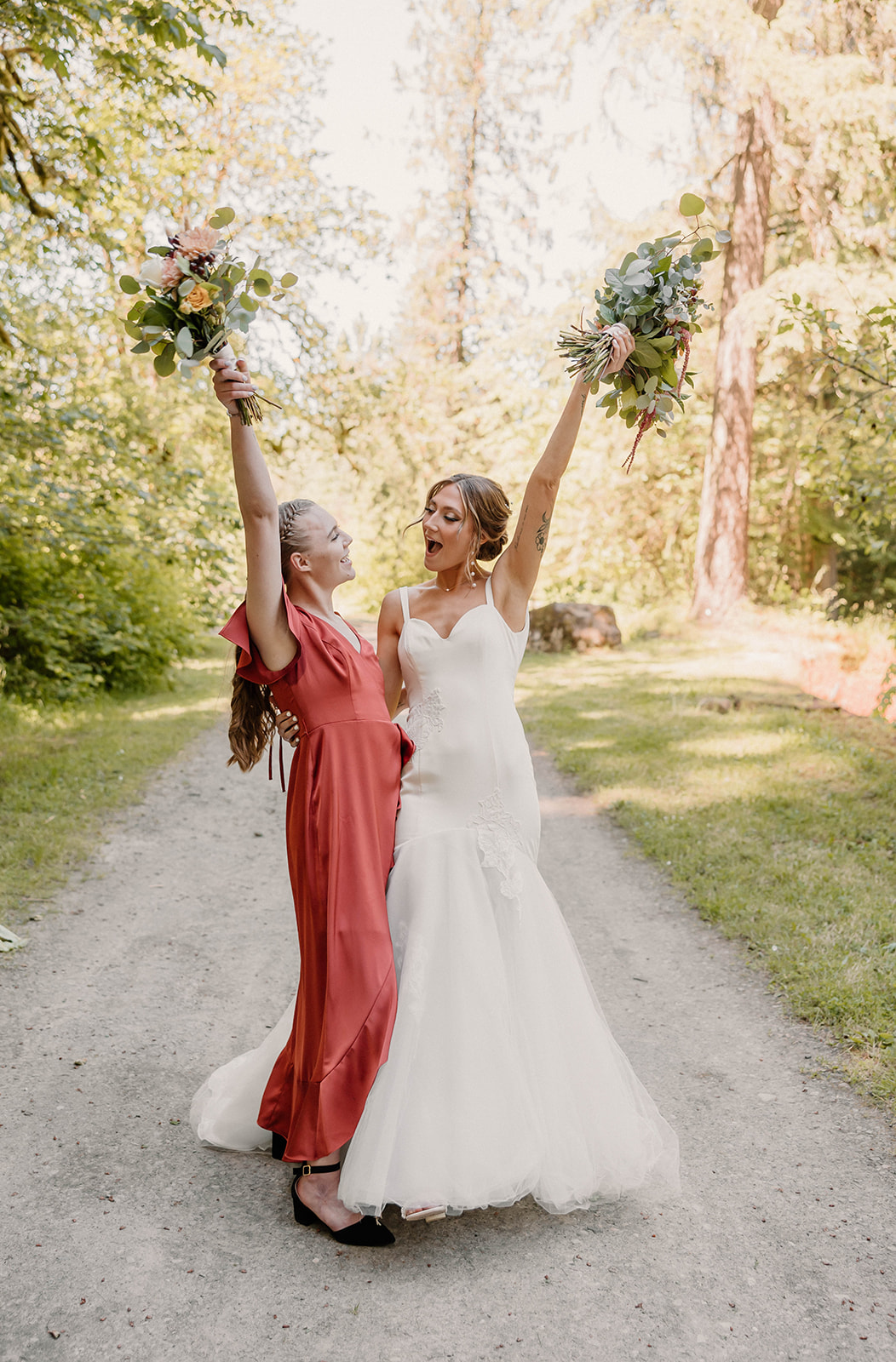 bride posing with their bridesmaid Camp Colton - A Mystical Oregon Wedding Venue
