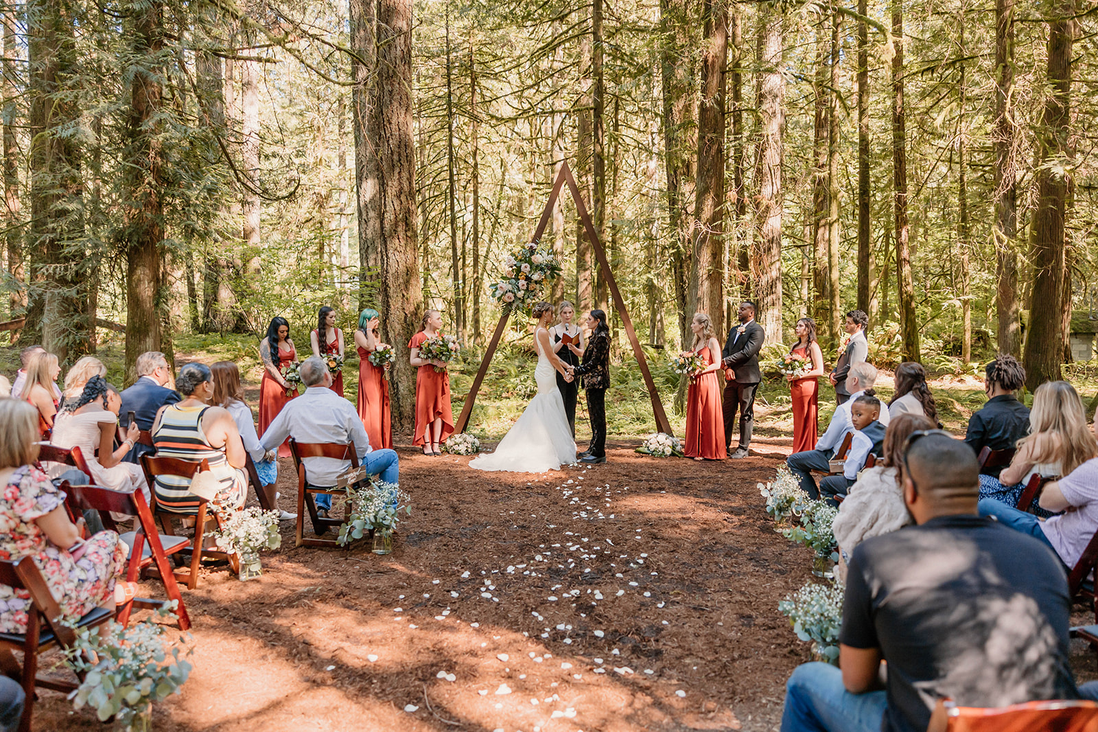 married couple during their ceremony in a forest Camp Colton - A Mystical Oregon Wedding Venue