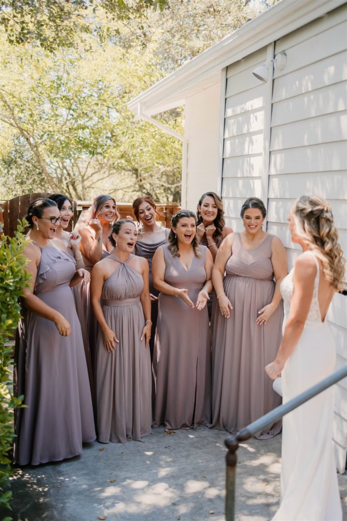 bride first look with her bridesmaids