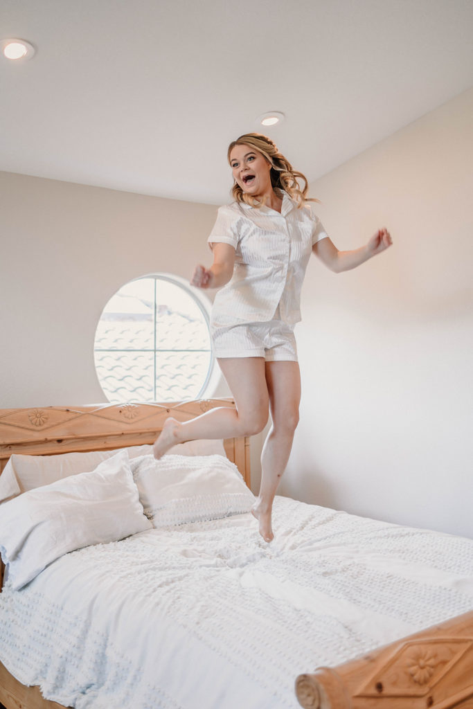 bride jumping on bed before sanoma ca wedding day