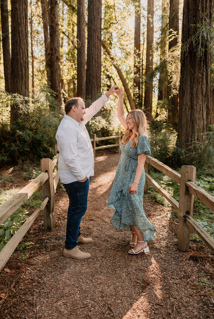 Couple posing for engagement photos in Riverfront Regional Park in Sanoma County California
