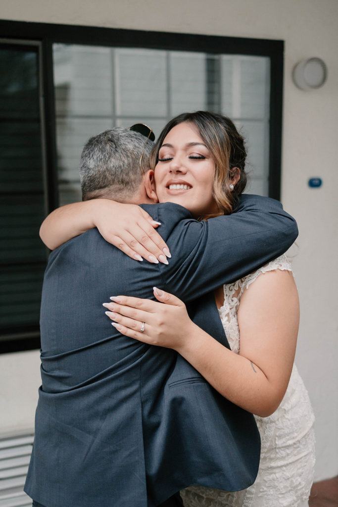 Brides first look with her father before her An Intimate Wedding at St. Rose of Lima Catholic Church in Santa Rosa, CA