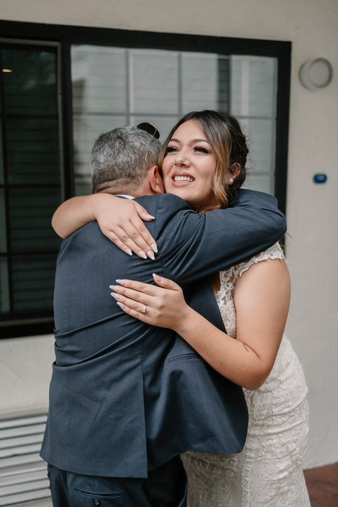 Brides first lookwith her father before her An Intimate Wedding at St. Rose of Lima Catholic Church in Santa Rosa, CA
