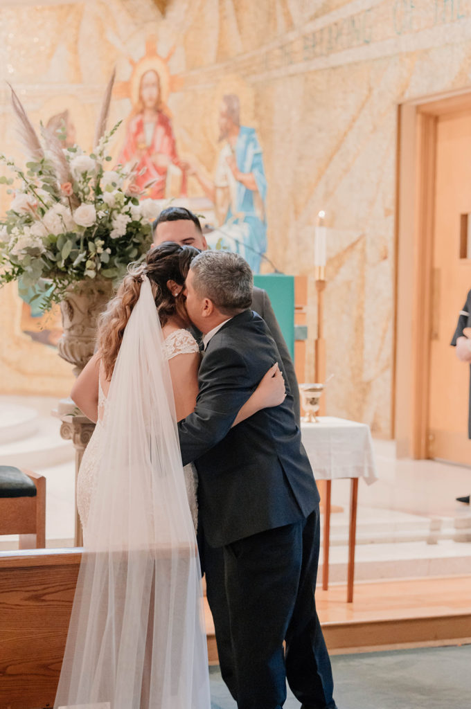 Bride and her father walking down the aisle for her Intimate Wedding at St. Rose of Lima Catholic Church in Santa Rosa, CA