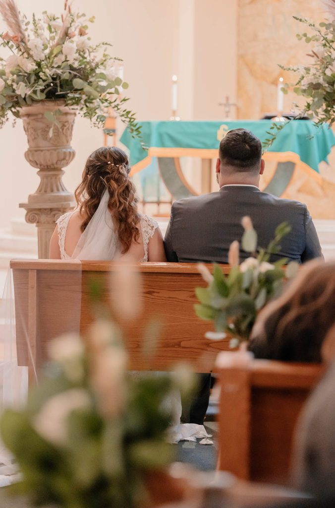 Bride and groom at the altar at St.Rose of Lima atholic Church wedding 