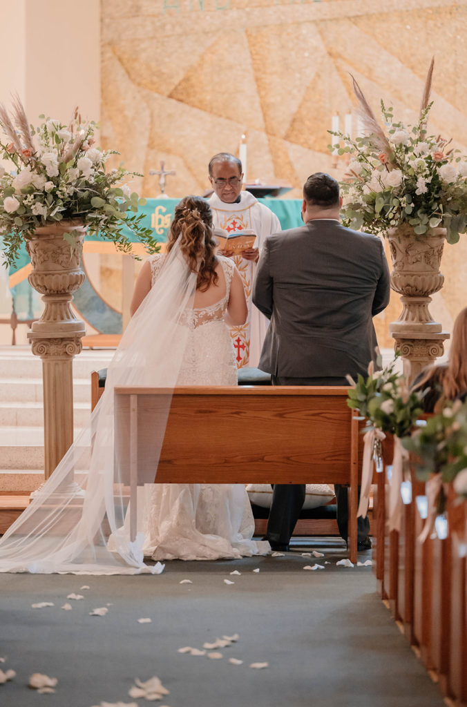 Bride and groom at the altar for An Intimate Wedding at St. Rose of Lima Catholic Church in Santa Rosa, CA
