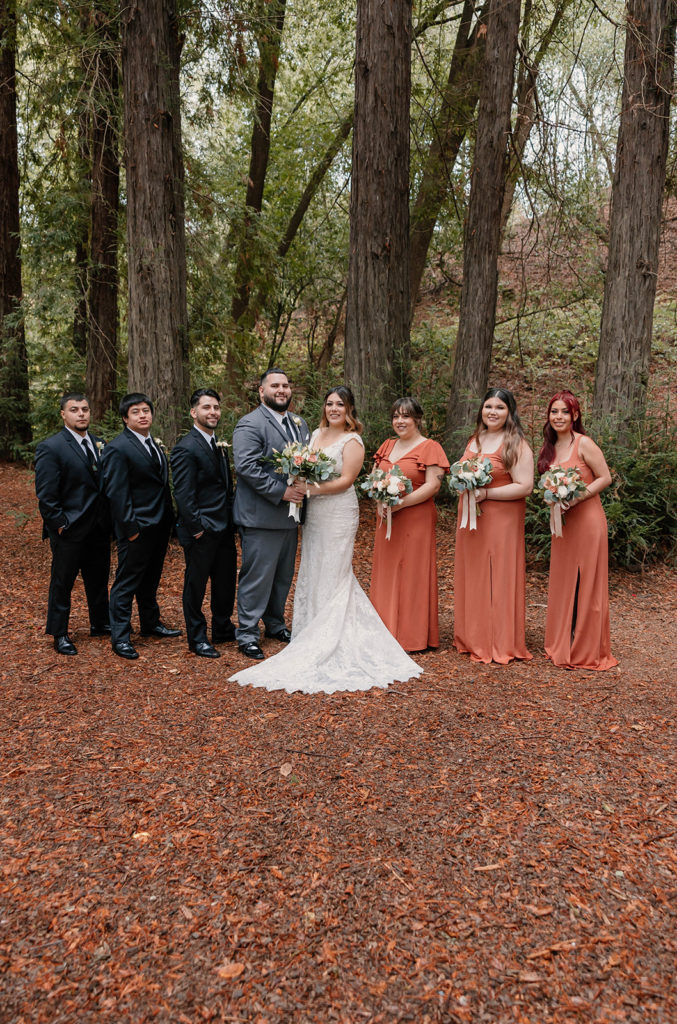Entire bridal party posing for photos