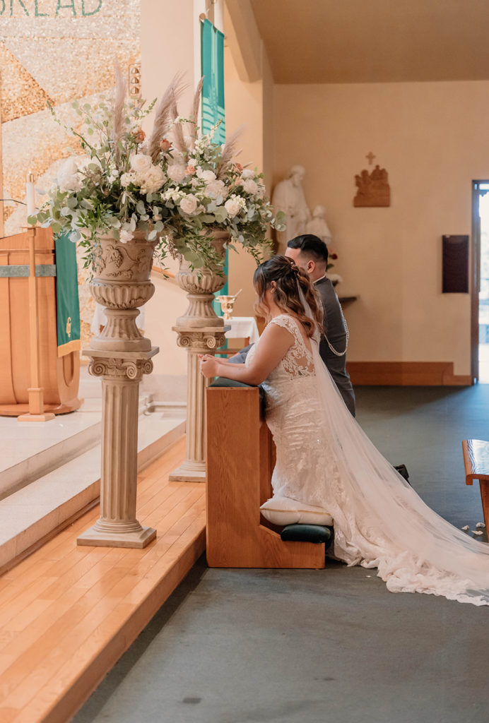 Bride and groom at the altar for their intimate Wedding at St. Rose of Lima Catholic Church in Santa Rosa, CA