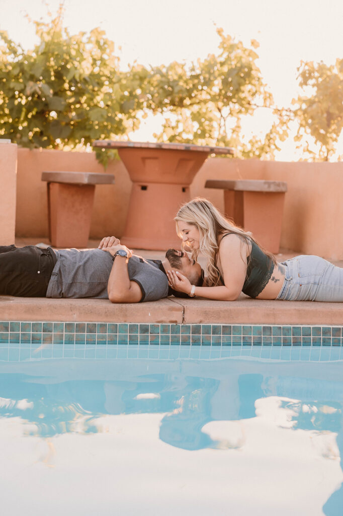 Engagement photos by a pool