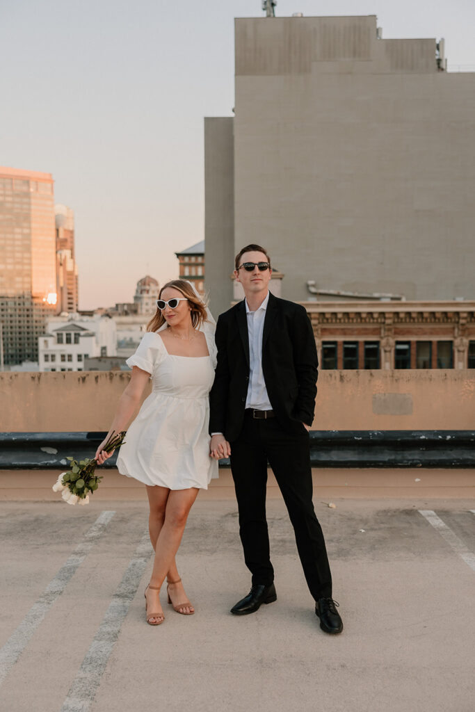 Bride and groom posing on a San Francisco rooftop for California elopement photos