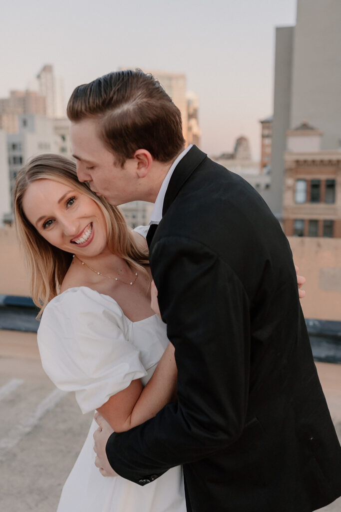 Bride and groom posing on a San Francisco rooftop for California elopement photos