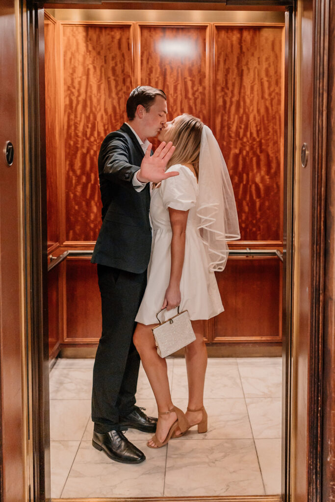 Bride and groom posing for San Francisco California elopement portraits at The Palace Hotel