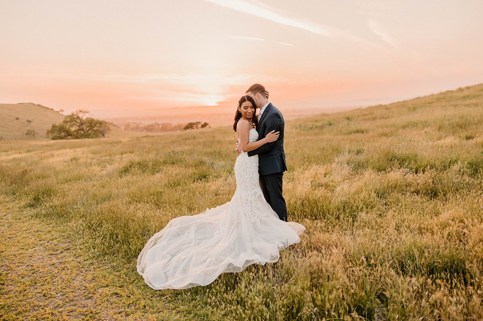 BRIDE AND GROOM POSING FOR A SUNSET BRIDAL SESSION AT CRANE CREEK IN SANTA ROSA