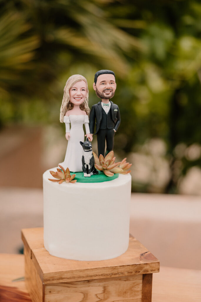 Bride and grooms custom bobble head cake topper