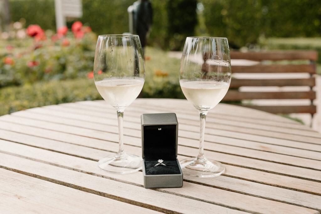 Wine glasses and engagement ring