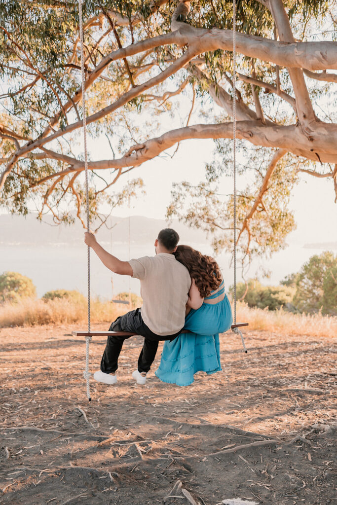 Couple sitting on a swing together