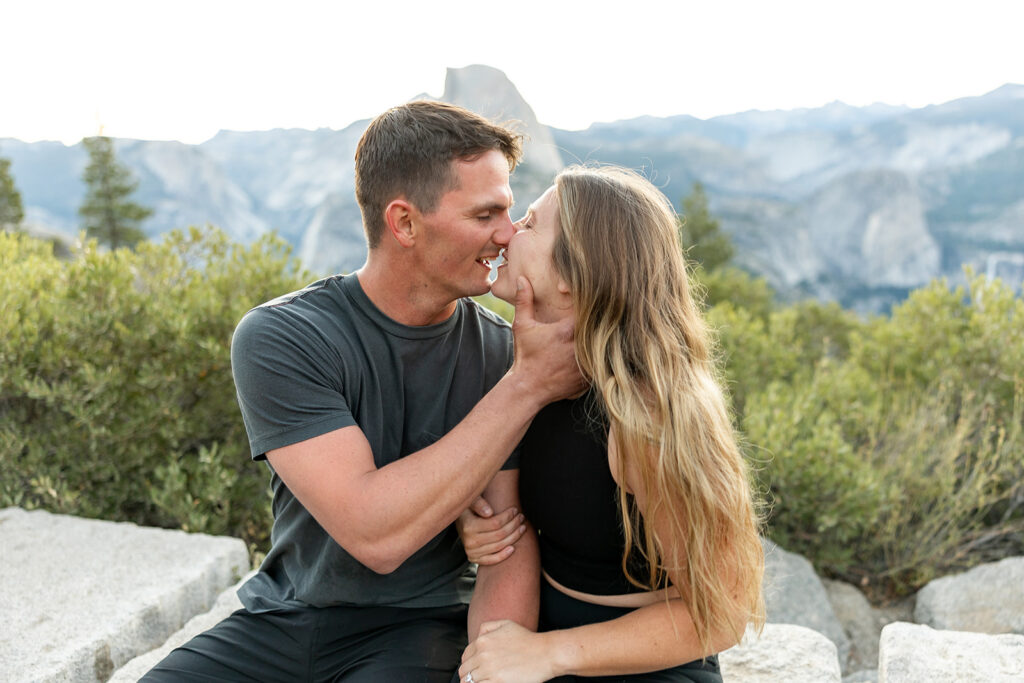 couple taking engagement photos in yosemite