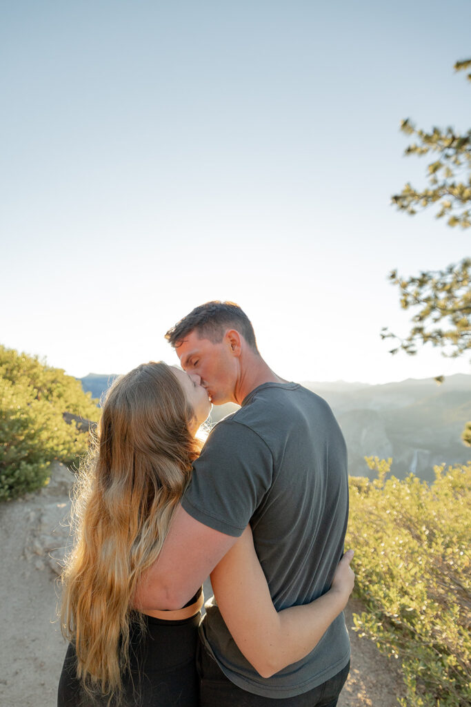 couple taking engagement photos in yosemite
