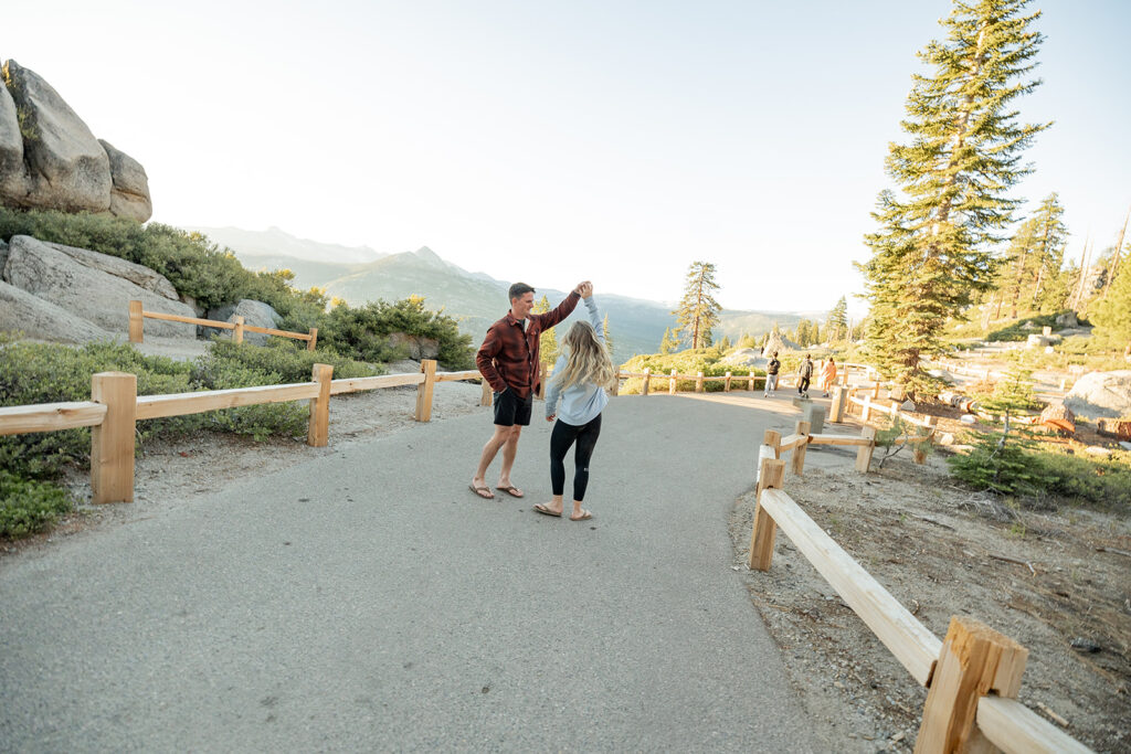 couple taking engagement photos in yosemite
