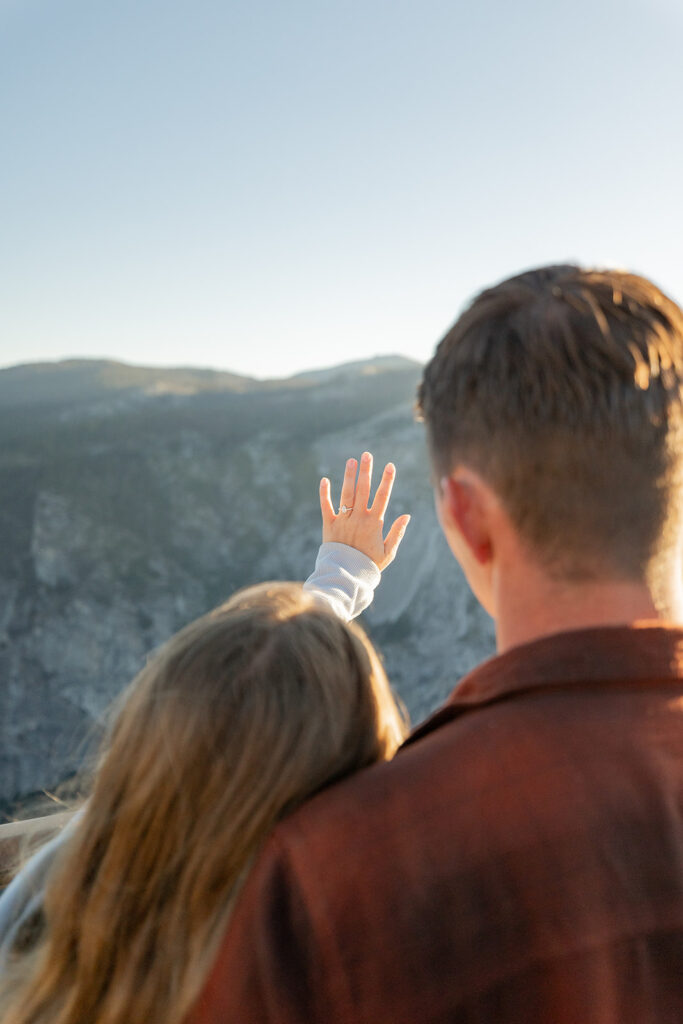 couple taking engagement photos in yosemite
