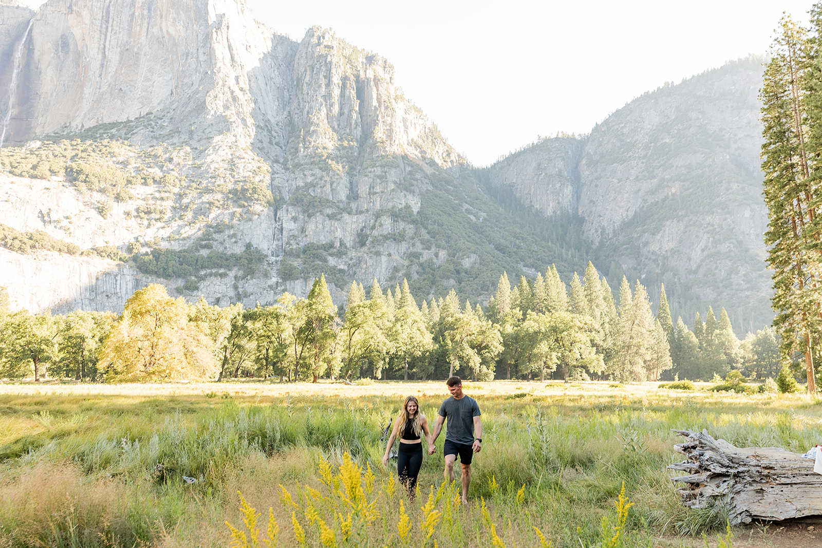 couple taking engagement photos in yosemite