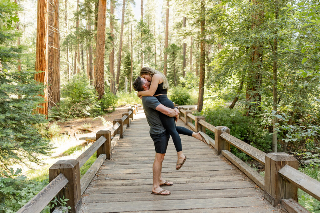 couple taking engagement photos in yosemite
