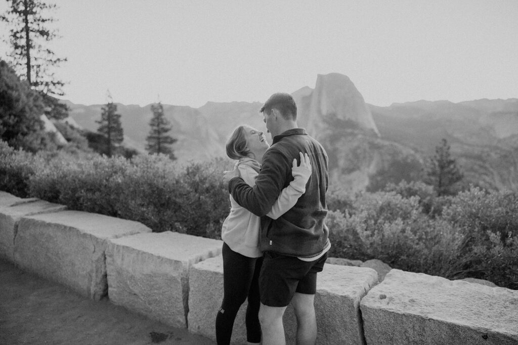 couple taking engagement photos in yosemite