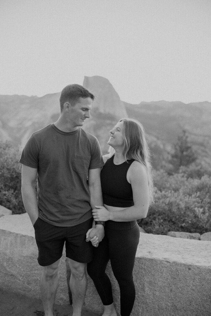 couple taking engagement photos in yosemite
