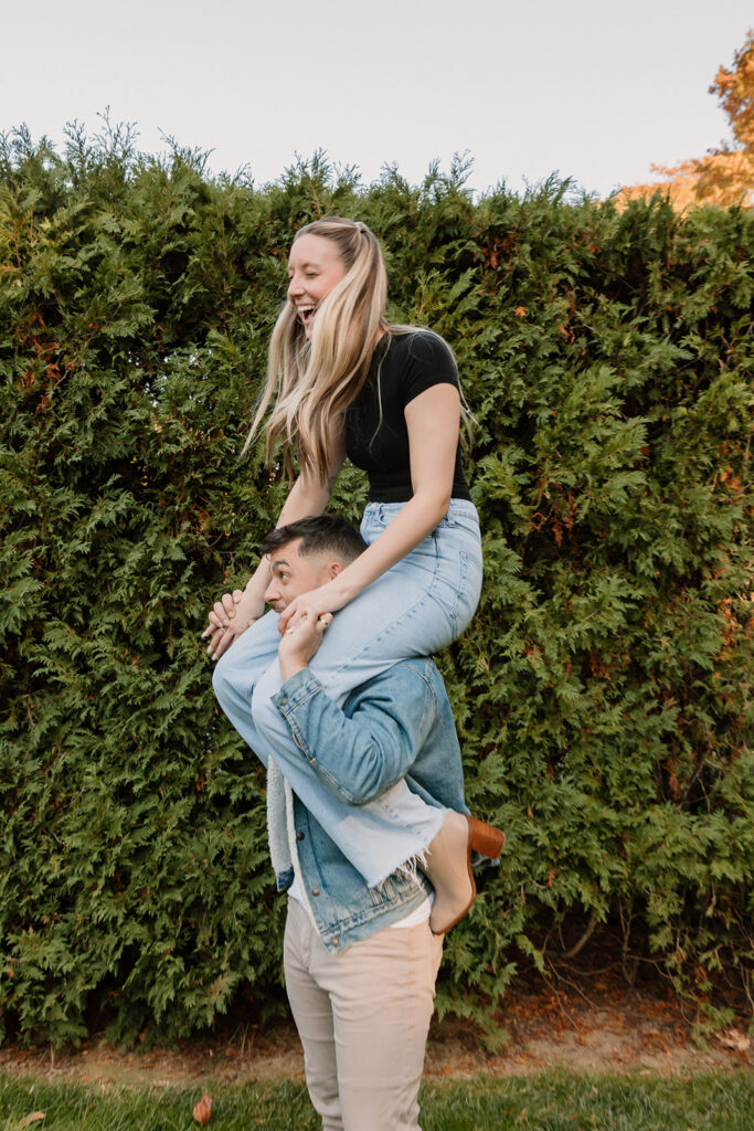 Couple taking engagement photos outside
