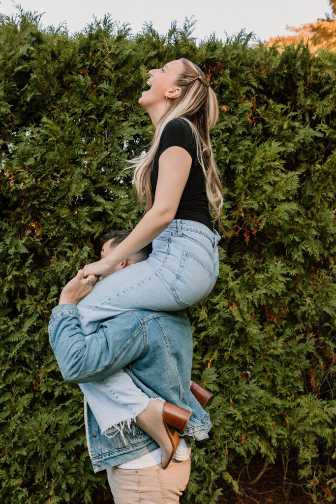 couple posing outdoors for an engagement
