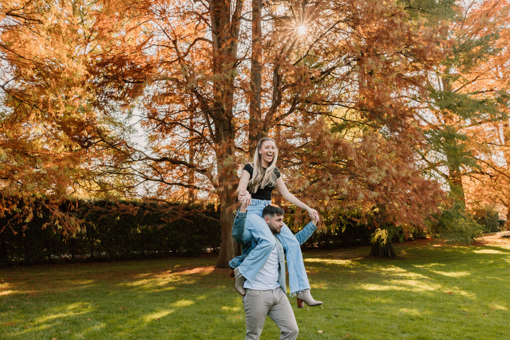 couple posing outdoors for an engagement
