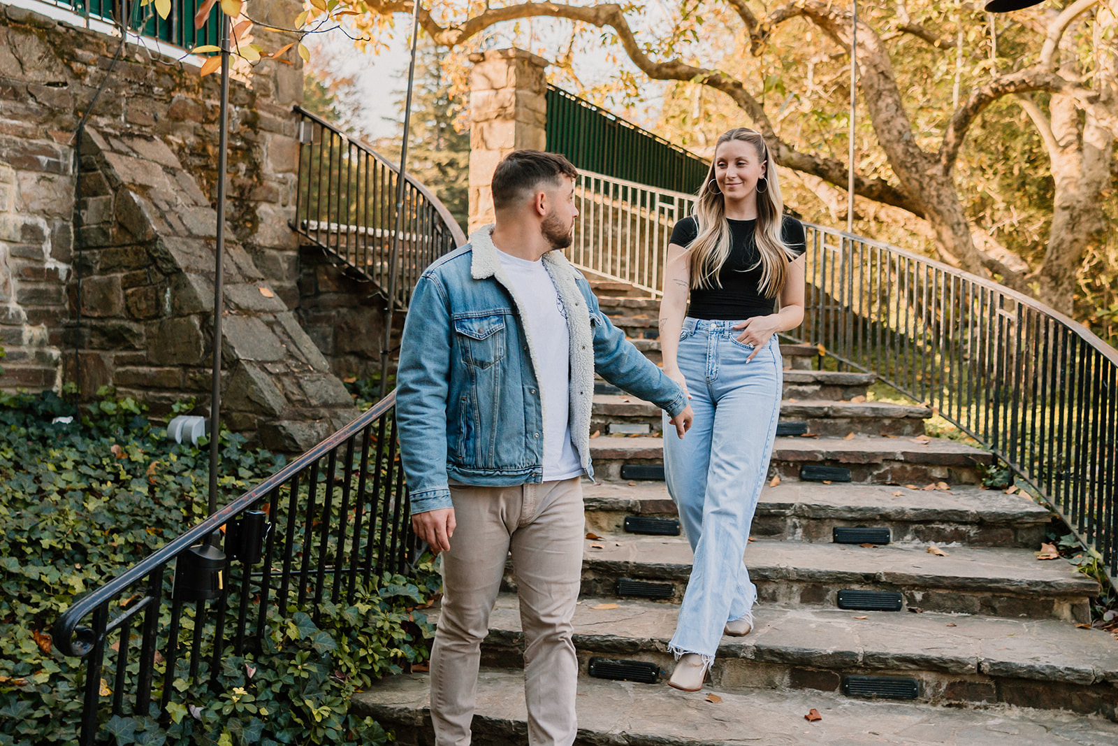 couple posing outdoors for an engagement