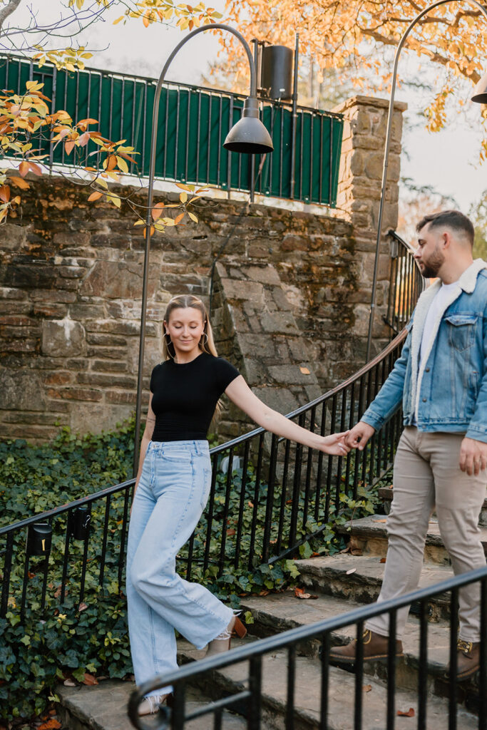 couple posing outdoors for an engagement
