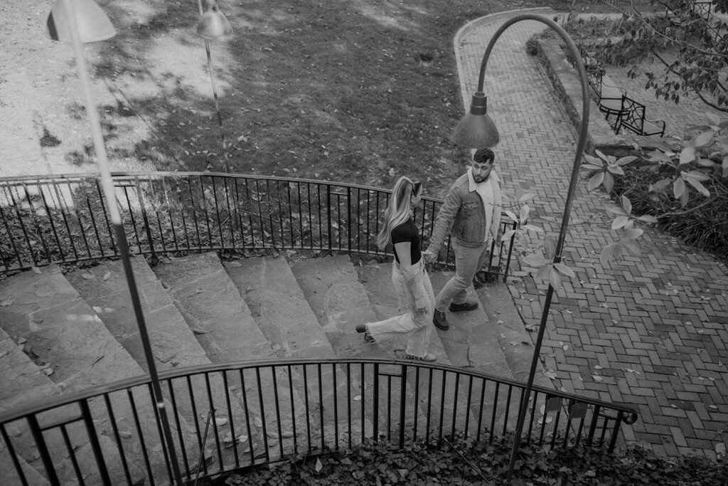 couple posing outdoors for an engagement
