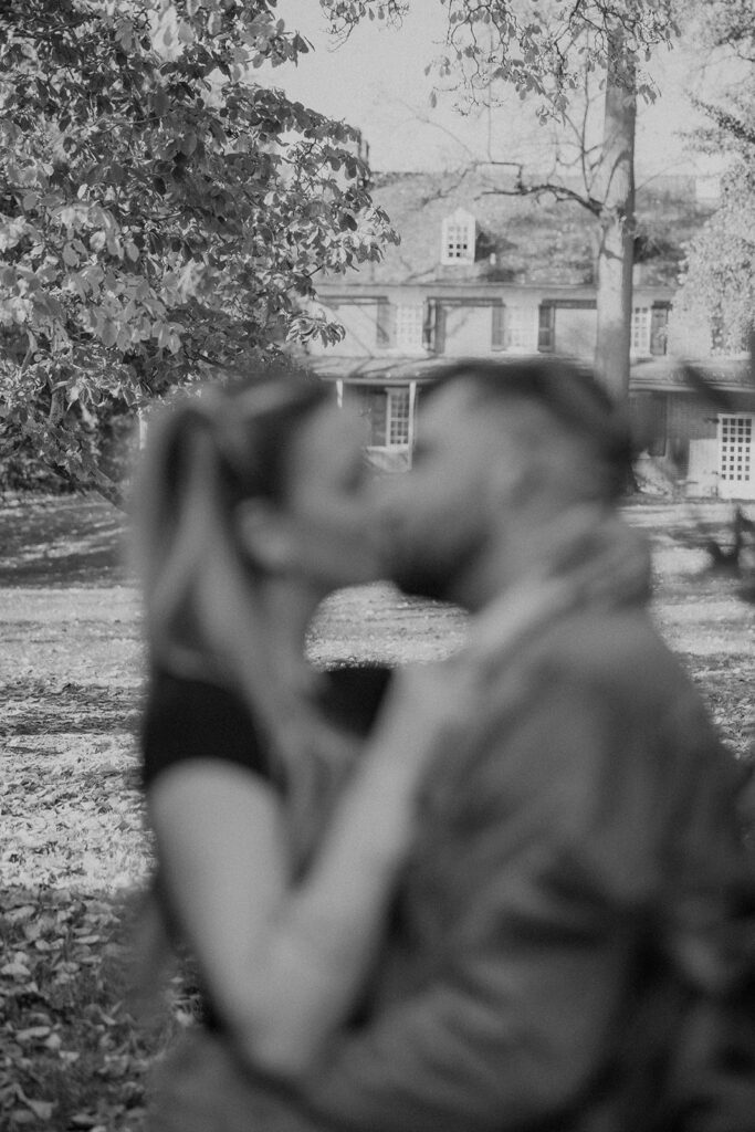 couple posing outdoors for an engagement