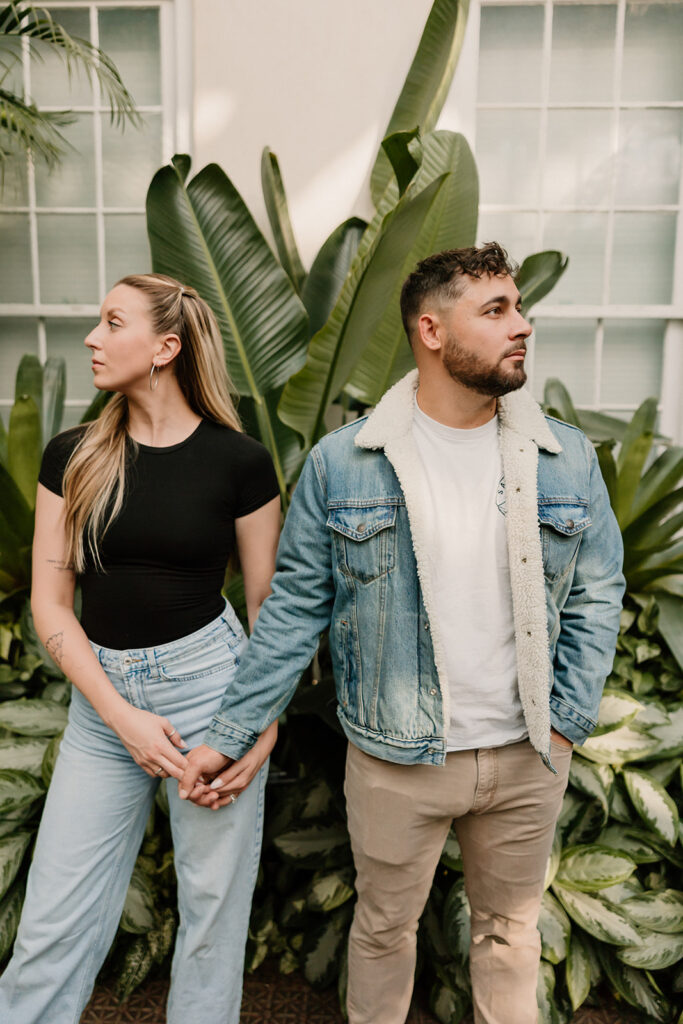 couple posing outdoors for an engagement
