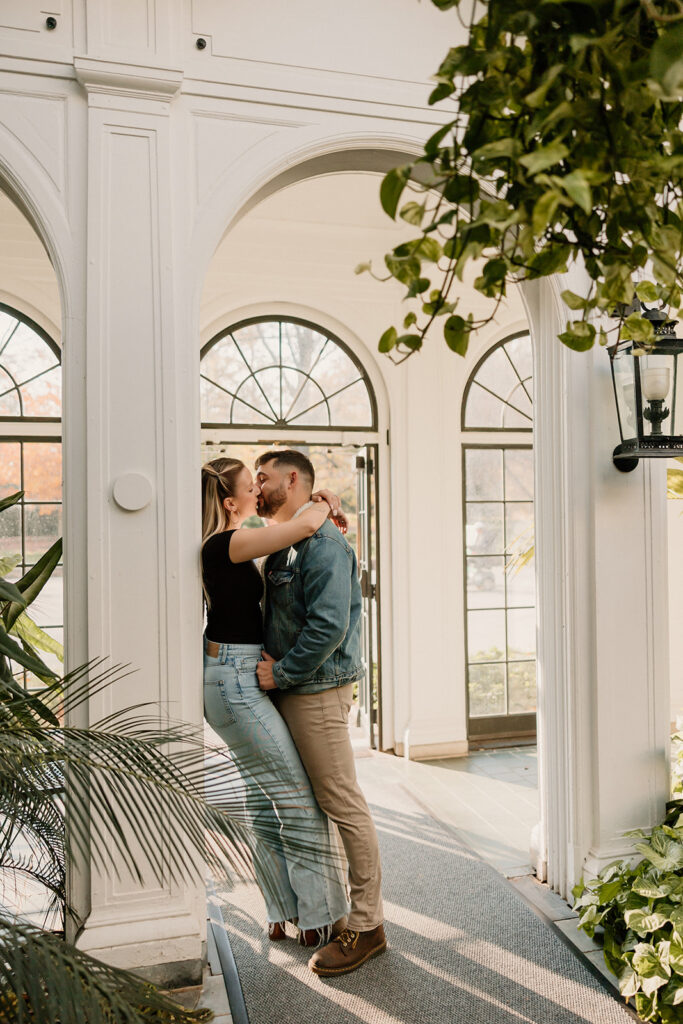 Couple taking engagement photos outside
