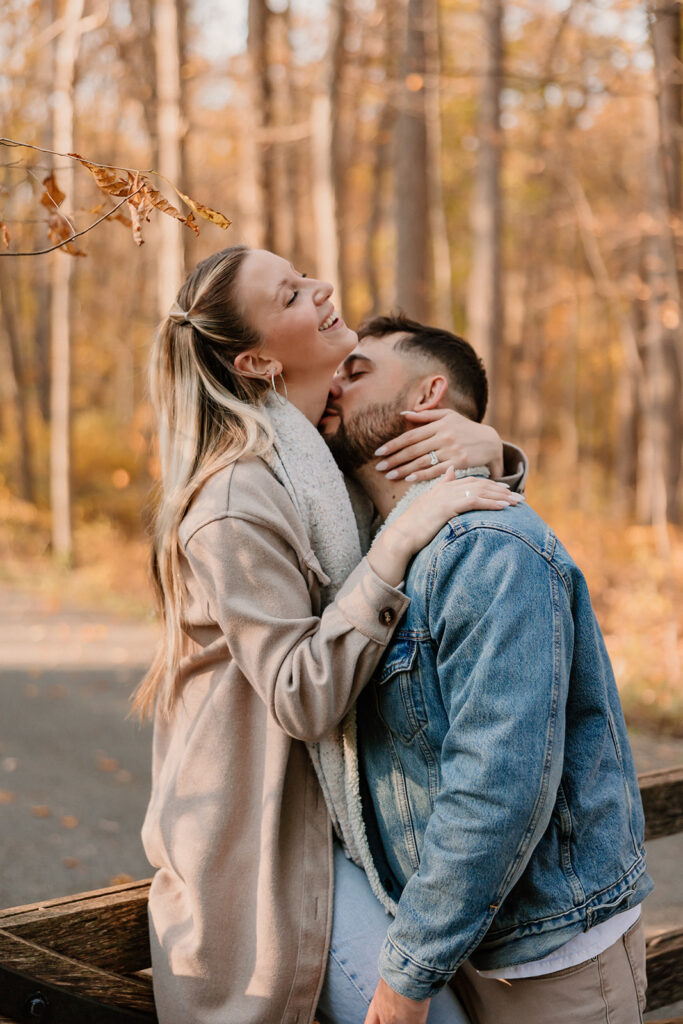 Couple taking engagement photos outside
