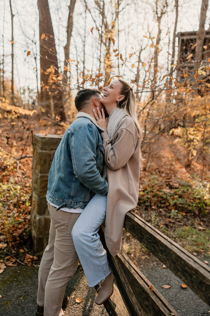 couple posing outdoors for an engagement