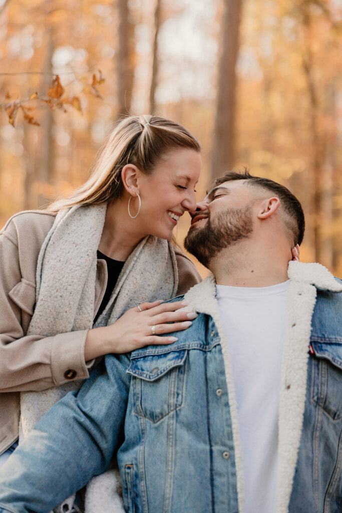 Couple taking engagement photos outside
