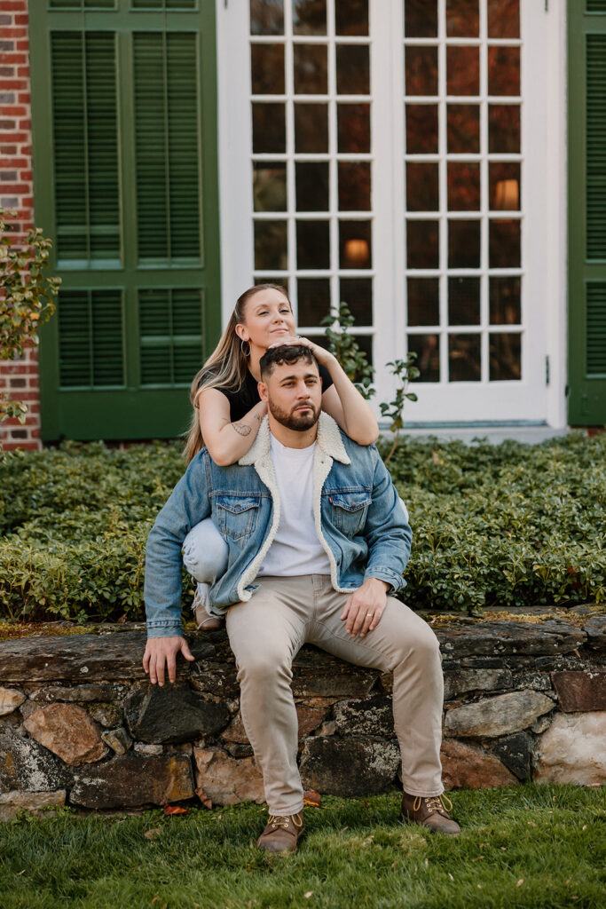 Couple taking engagement photos outside
