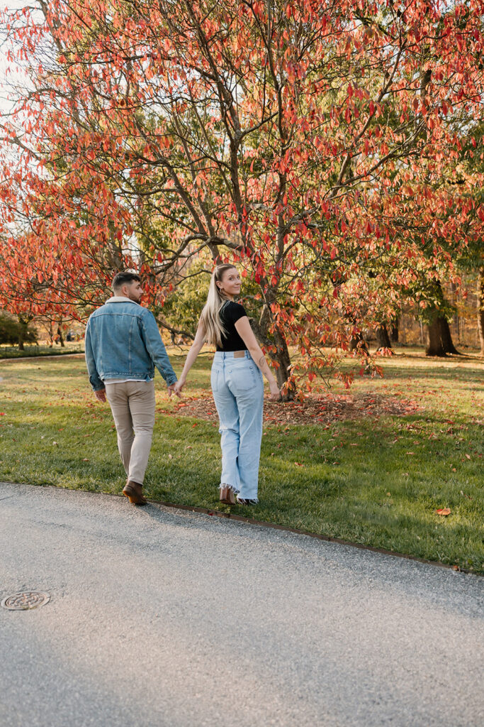 Couple taking engagement photos outside
