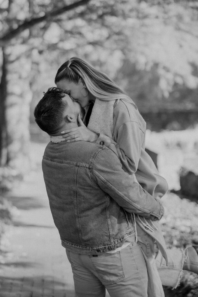 Couple taking engagement photos outside
